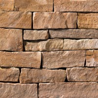 A red and tan stone veneer perfect for any hardscape idea on the exterior or interior of any home or landscape.