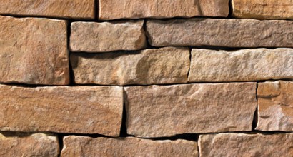 A red and tan stone veneer perfect for any hardscape idea on the exterior or interior of any home or landscape.