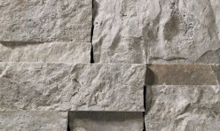 A grey stone veneer with a few lilac accents perfect for any hardscape idea on the exterior or interior of any home or landscape.