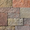A grey, lilac, pink, and red stone veneer with some purple hues and tan or golden accents perfect for any hardscape idea on the exterior or interior of any home or landscape.