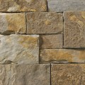 A brown, tan, and grey stone veneer with some rust-colored accents perfect for any hardscape idea on the exterior or interior of any home or landscape.