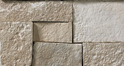 A light grey stone veneer with subtle tan and lighter grey accents perfect for any hardscape idea on the exterior or interior of any home or landscape.