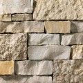 A light grey and tan stone veneer with a mixture of smooth and rough textures perfect for any hardscape idea on the exterior or interior of any home or landscape.