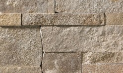 A grey and tan stone veneer with a slightly warm hue and a few rose-colored accents perfect for any hardscape idea on the exterior or interior of any home or landscape.