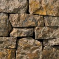 A rust and dark grey stone veneer with a mottled appearance perfect for any hardscape idea on the exterior or interior of any home or landscape.