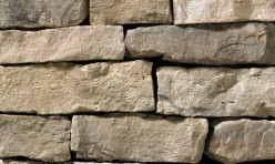 A brown-grey stone veneer with a slightly warm tone perfect for any hardscape idea on the exterior or interior of any home or landscape.