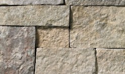 A tumbled cool-grey stone veneer with subtle tan accents perfect for any hardscape idea on the exterior or interior of any home or landscape.