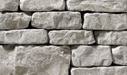 A light grey, tumbled stone veneer perfect for any hardscape idea on the exterior or interior of any home or landscape.