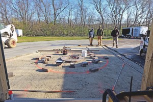 Installing a paver patio, valencia fire pit, and sitting walls in Waynesville, OH using products from Belgard and Techo-Bloc.