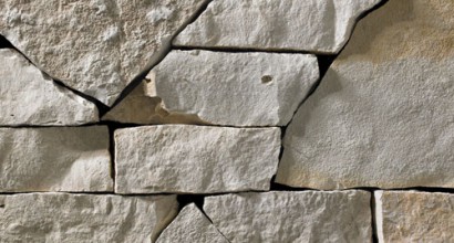 A light grey webwall stone veneer with subtle golden accents that is perfect for application to any hardscape idea on the exterior or interior of any home or landscape.