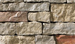 A light grey stone veneer with warm accents perfect for any hardscape idea on the exterior or interior of any home or landscape.