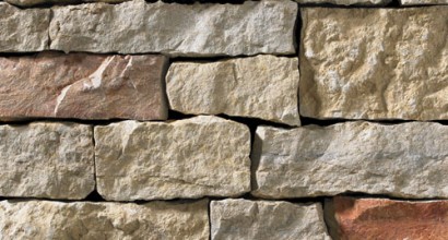 A light grey stone veneer with warm accents perfect for any hardscape idea on the exterior or interior of any home or landscape.