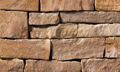 A red and tan stone veneer perfect for any hardscape idea on the exterior or interior of any home or landscape.