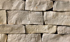 A light grey stone veneer with very subtle tan accents perfect for any hardscape idea on the exterior or interior of any home or landscape.