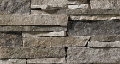 A dark stone veneer for use in interiors as well as the outdoors. This building stone features dark grays with some subtle brown accents.