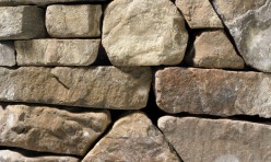 A grey and brown stone veneer with smooth edges perfect for any hardscape idea on the exterior or interior of any home or landscape.