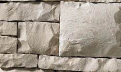 A light grey stone veneer with golden accents perfect for any hardscape idea on the exterior or interior of any home or landscape.