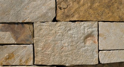 A brown, tan, and grey stone veneer perfect for any hardscape idea on the exterior or interior of any home or landscape.