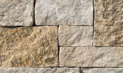 A light grey stone veneer with brown and tan accents perfect for any hardscape idea on the exterior or interior of any home or landscape.