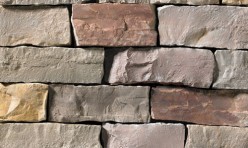 A grey, red, and tan stone veneer perfect for any hardscape idea on the exterior or interior of any home or landscape.