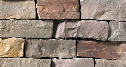 A grey, red, and tan stone veneer perfect for any hardscape idea on the exterior or interior of any home or landscape.