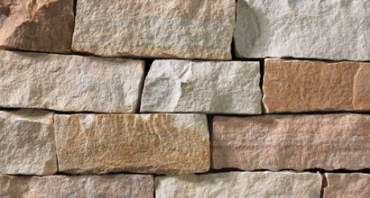 A light grey, tan, and rose-colored stone veneer perfect for any hardscape idea on the exterior or interior of any home or landscape.