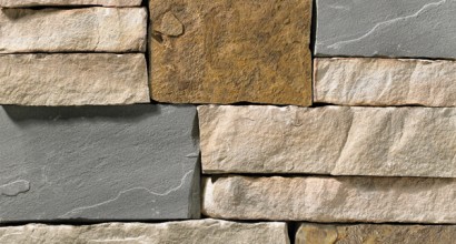 A stone veneer with light, warm hues and brown and grey modules perfect for any hardscape idea on the exterior or interior of any home or landscape.