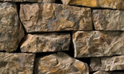 A rust and dark grey stone veneer with a mottled appearance perfect for any hardscape idea on the exterior or interior of any home or landscape.