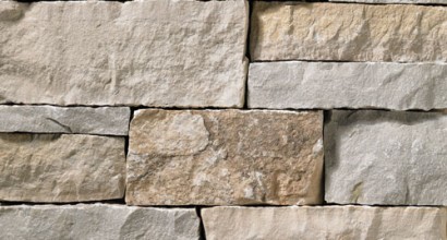 A light grey and tan stone veneer perfect for any hardscape idea on the exterior or interior of any home or landscape.