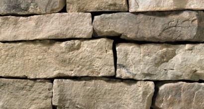 A brown-grey stone veneer with a slightly warm tone perfect for any hardscape idea on the exterior or interior of any home or landscape.
