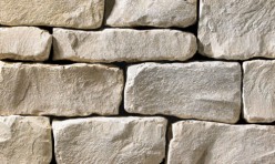 A grey stone veneer with a tumbled texture and a few tan accents perfect for any hardscape idea on the exterior or interior of any home or landscape.