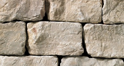 A grey stone veneer with a tumbled texture and very subtle tan hue perfect for any hardscape idea on the exterior or interior of any home or landscape.