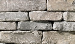 A light grey stone veneer with very subtle tan accents perfect for any hardscape idea on the exterior or interior of any home or landscape.