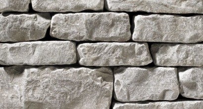 A light grey, tumbled stone veneer perfect for any hardscape idea on the exterior or interior of any home or landscape.