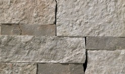 A grey stone veneer with darker grey accents and a few sparse, subtle tan tones perfect for any hardscape idea on the exterior or interior of any home or landscape.