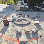 Installing a paver patio, valencia fire pit, and sitting walls in Waynesville, OH using products from Belgard and Techo-Bloc.