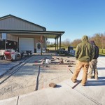 Installing a paver patio, valencia fire pit, and sitting walls in Waynesville, OH using products from Belgard and Techo-Bloc.