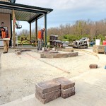 Installing a paver patio, valencia fire pit, and sitting walls in Waynesville, OH using products from Belgard and Techo-Bloc.