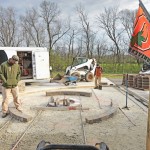 Installing a paver patio, valencia fire pit, and sitting walls in Waynesville, OH using products from Belgard and Techo-Bloc.